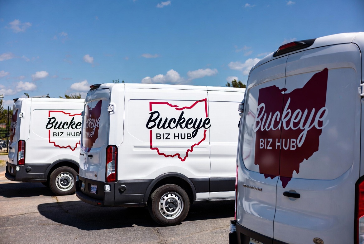 Mockup of white work vans with fleet lettering